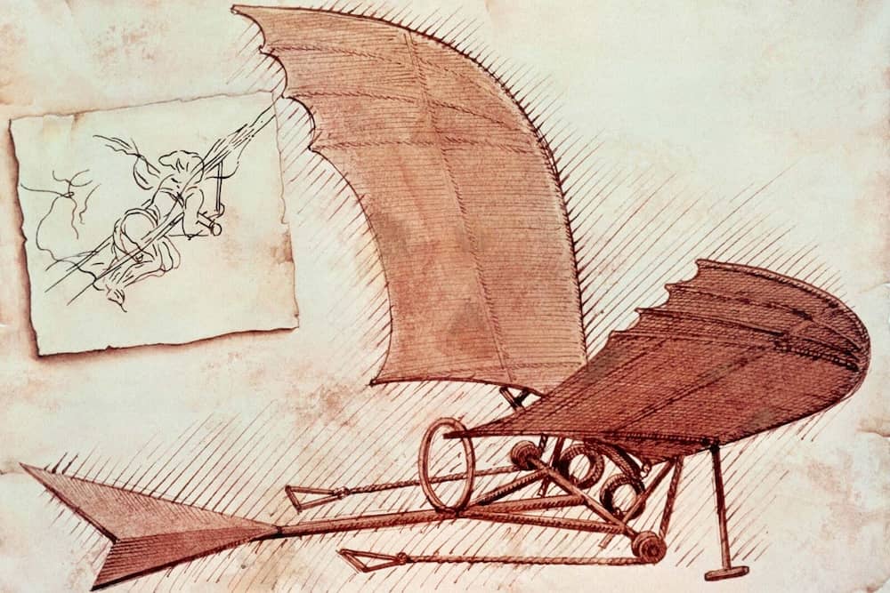 Illustration of Leonardo da Vinci’s flying machine concept, featuring large bird-like wings and a sketch of a human figure in flight, reflecting his early exploration of human-powered aviation.